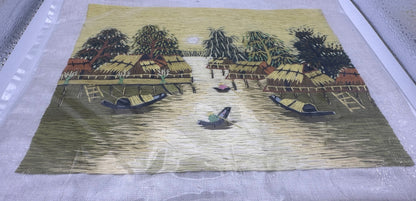 Vintage Southeast Asian textile artwork with yellow silk thread design and handcrafted cultural details