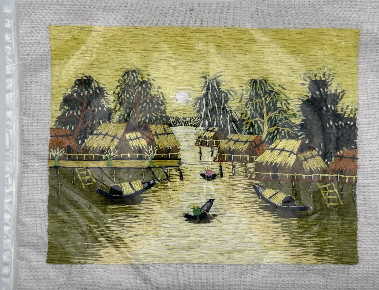 Unframed 1970s Southeast Asian silk thread artwork featuring intricate yellow textile craftsmanship
