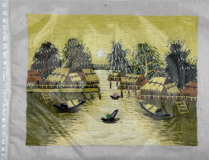Unframed 1970s Southeast Asian silk thread artwork featuring intricate yellow textile craftsmanship