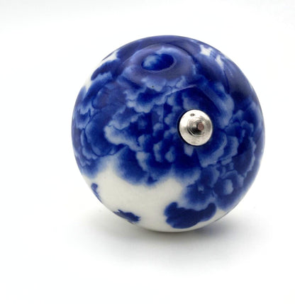 Blue and white ceramic knob on a white background