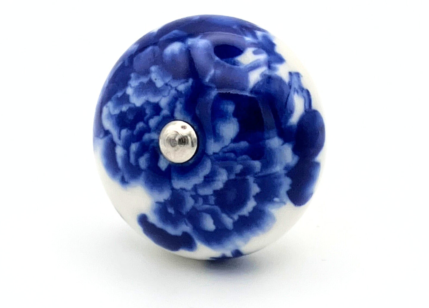 Blue and white floral ceramic knob on a white background