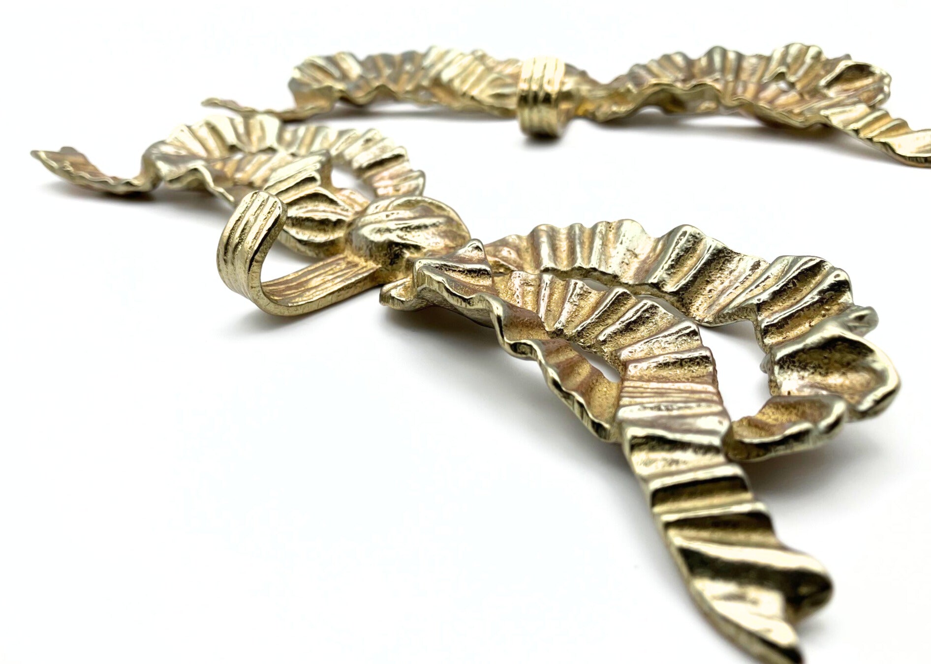 2 brass gold bow wall hooks