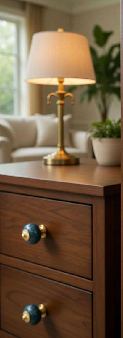 Wooden nightstand with a lamp and decorative knobs in a home setting