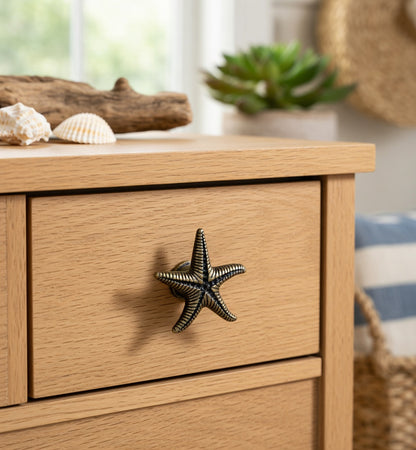 Wooden drawer with starfish handle in a coastal-themed room