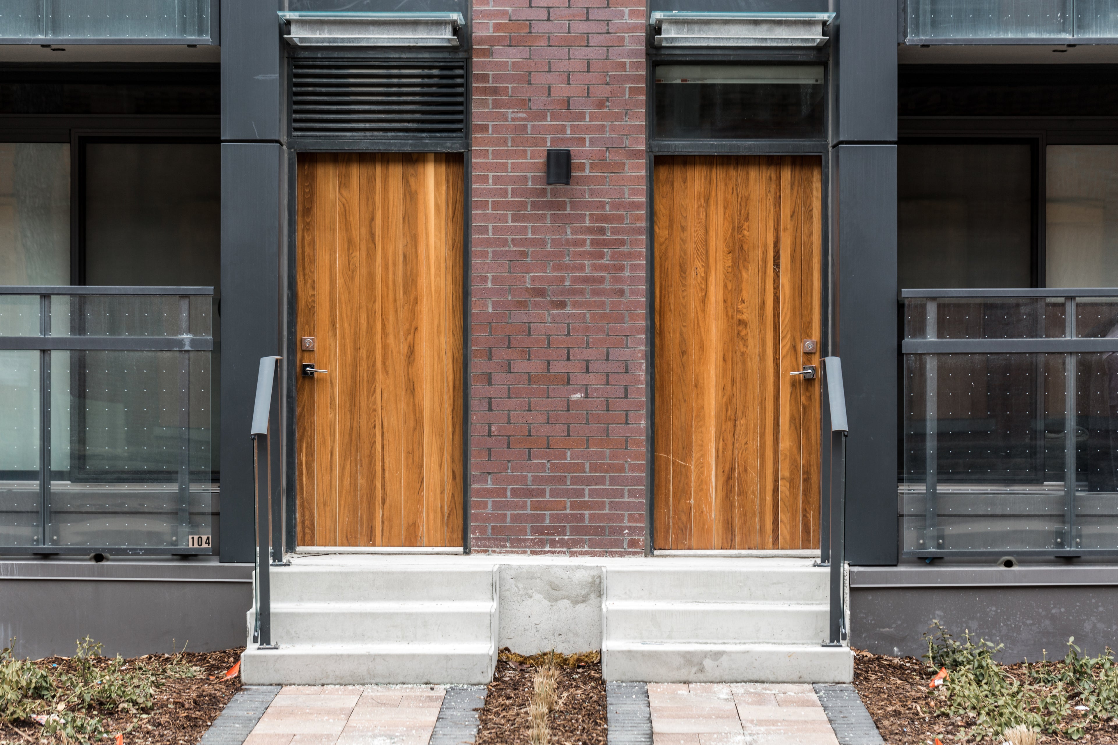 Twin wooden doors to separate entrances of a building
